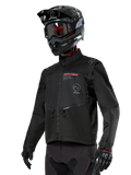 Alpinestars Pro-Dura Jacket, Off-Road Motorcycle Jacket, Black with red and grey branding, features zippered front pockets and high collar, worn with a black motocross helmet and gloves for enduro racing