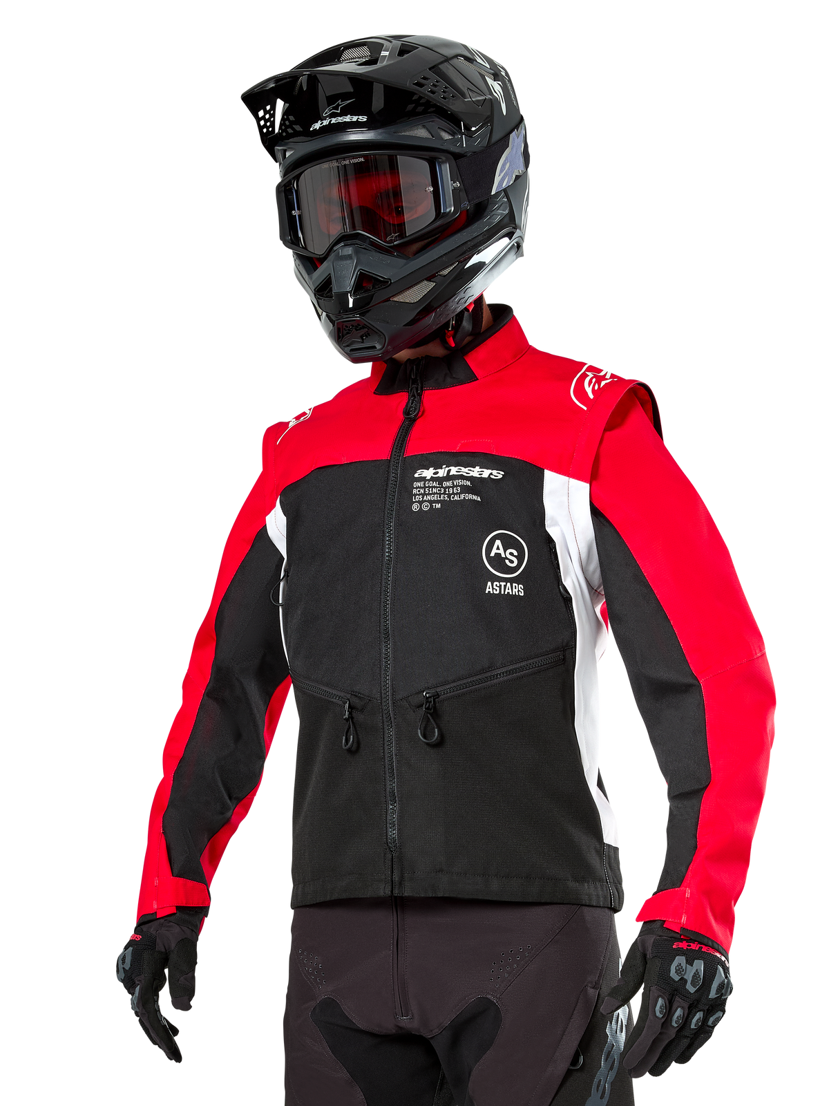 Alpinestars Pro-Dura Jacket, casaco de motociclismo para enduro e off-road, preto com blocos de cores em vermelho vivo e branco, usado por um piloto com capacete preto e óculos, com bolsos frontais com fecho e marca Alpinestars, construção em têxtil resistente para trilhos
