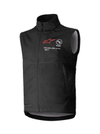 Alpinestars Techstar Softshell Vest, Black Sleeveless Motocross Vest, high collar with front zipper, featuring red star logo with "ASTARS" and "ONE GOAL. ONE VISION." chest branding, lightweight windproof softshell fabric with light gray interior lining, designed for off-road riding