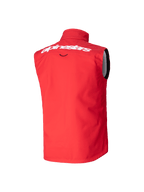Colete Youth Techstar Softshell Alpinestars, colete de motocross, vermelho vivo, vista traseira apresentando logótipo Alpinestars branco na parte superior das costas, design softshell sem mangas com gola alta para proteção contra o vento.