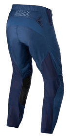 Alpinestars Techstar Phantom Pants, calças de motocross, azul escuro, vista traseira com painéis de rede respirável e patches de couro preto na parte interna da perna, com logótipo ASTARS no cós, concebidas para performance em todo-o-terreno