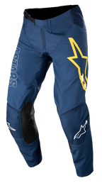 Alpinestars Techstar Phantom Pants, calças de motocross, azul escuro com detalhes em amarelo e branco, painéis de joelho em pele preta, logótipo de estrela amarela grande na coxa, marca ASTARS em branco, tecido rip-stop elástico durável para corridas todo-o-terreno