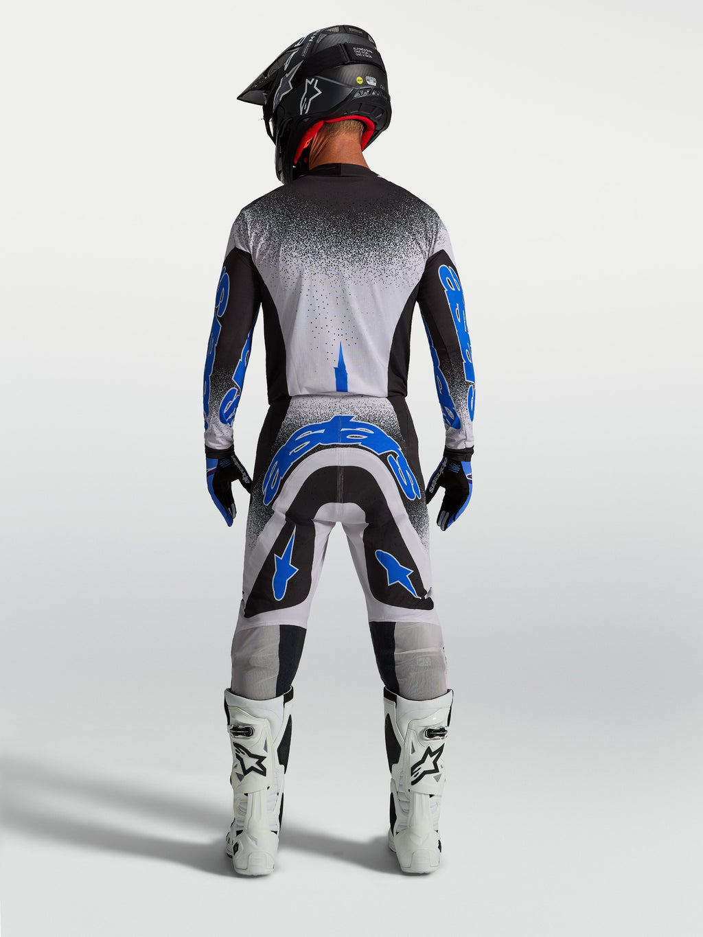 Alpinestars Supertech Hiten AFD, calças de motocross para homem, azuis e brancas, vista traseira com ajuste atlético.