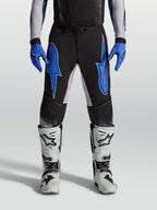 Alpinestars Supertech Hiten AFD, calças de motocross para homem, pretas e azuis, com construção ripstop elástica leve.