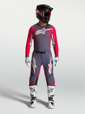 Alpinestars Supertech Hiten AFD Gear Set, fato de motocross em cinzento e vermelho fluorescente para alta performance.