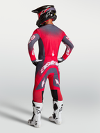 Alpinestars Supertech Hiten AFD, calças de motocross para homem, cinzento e vermelho fluo, vista traseira no modelo.