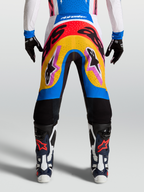 Alpinestars Supertech Dyna, calças de motocross profissionais, azul e amarelo, design multicolorido para corrida, leves e flexíveis.