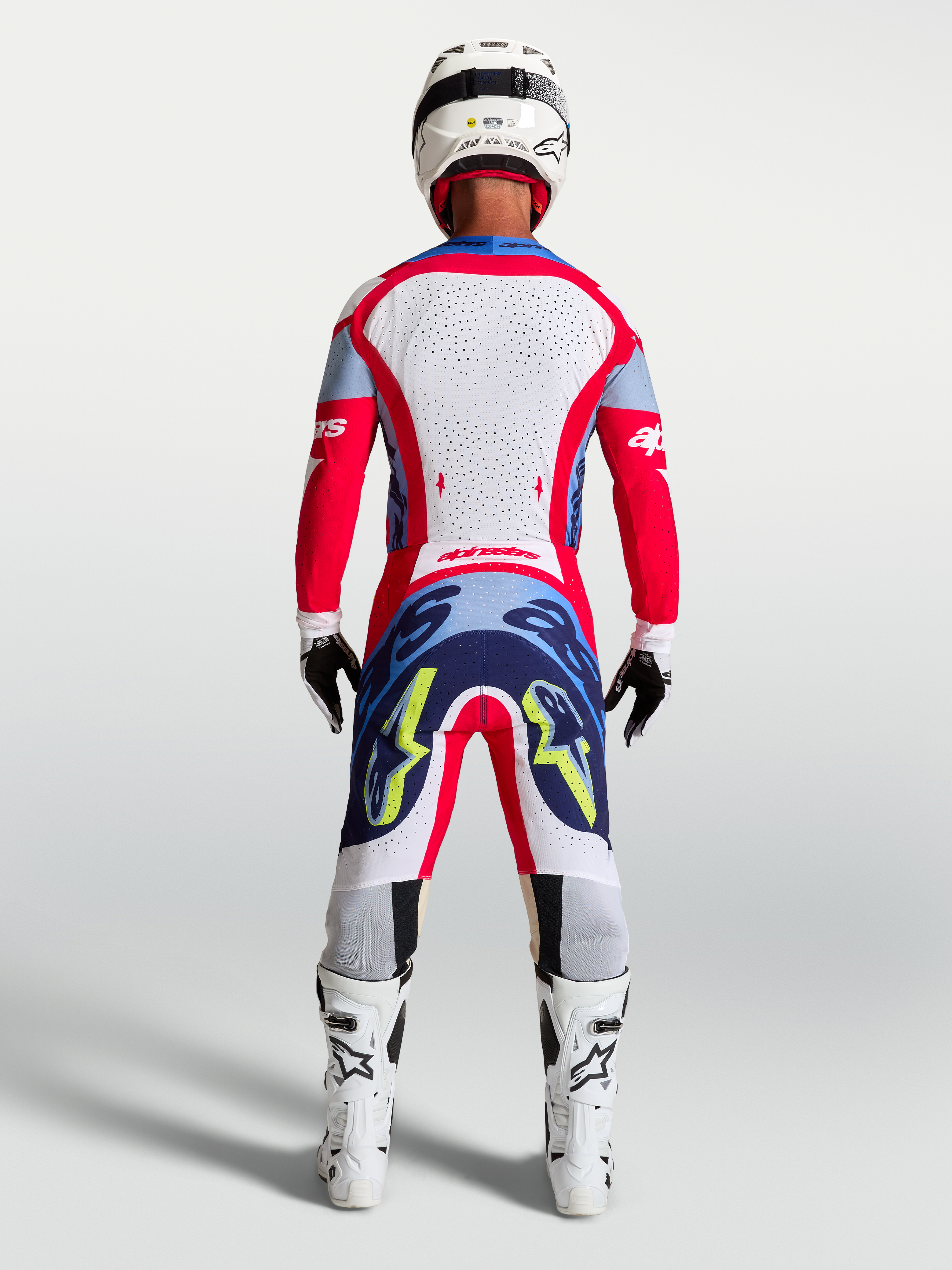 Alpinestars Supertech Dyna, calças de corrida de motocross para homem, vermelhas e azul-marinho, vista traseira.