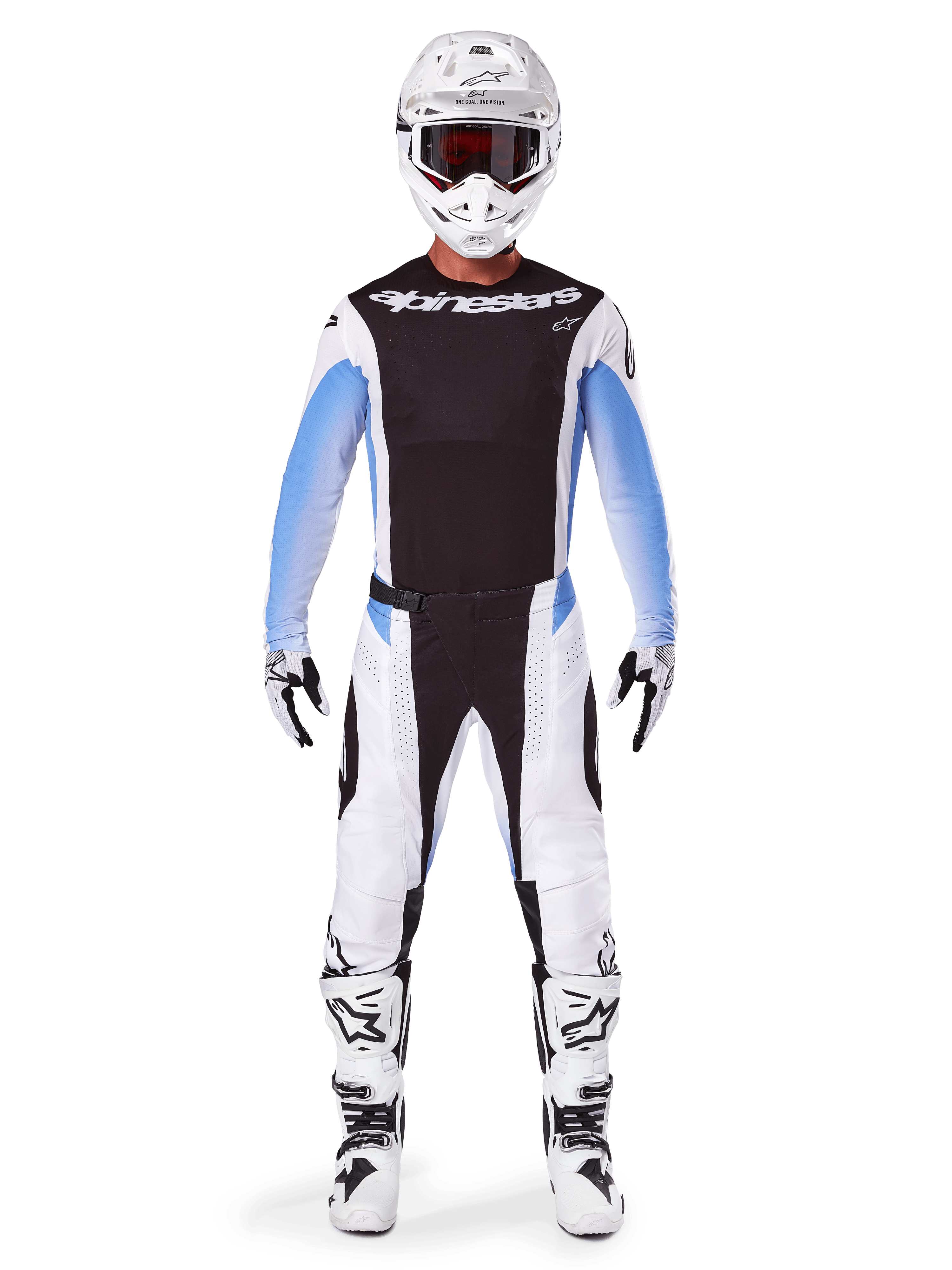 Piloto de motocross a usar as Calças Alpinestars 2025 Techstar Melt, calças de motocross, pretas e azuis, design de múltiplos painéis em branco e preto com detalhes azuis nas ancas, combinadas com camisola branca a condizer, capacete branco, luvas brancas e botas para um kit completo de corrida todo-o-terreno