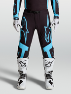 Alpinestars Calças Supertech Vesta, calças de motocross racing, pretas e azul turquesa com gráficos de estrela e painéis de joelho em couro