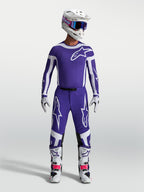 Alpinestars Supertech Vesta, calças de motocross para homem, azuis e brancas, ajuste atlético e tecido rip-stop durável.