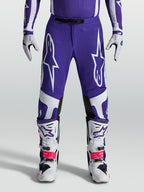 Alpinestars Calças Supertech Vesta, calças de motocross para homem, azuis e brancas, com ajuste atlético e construção rip-stop, ideais para desempenho em todo-o-terreno.