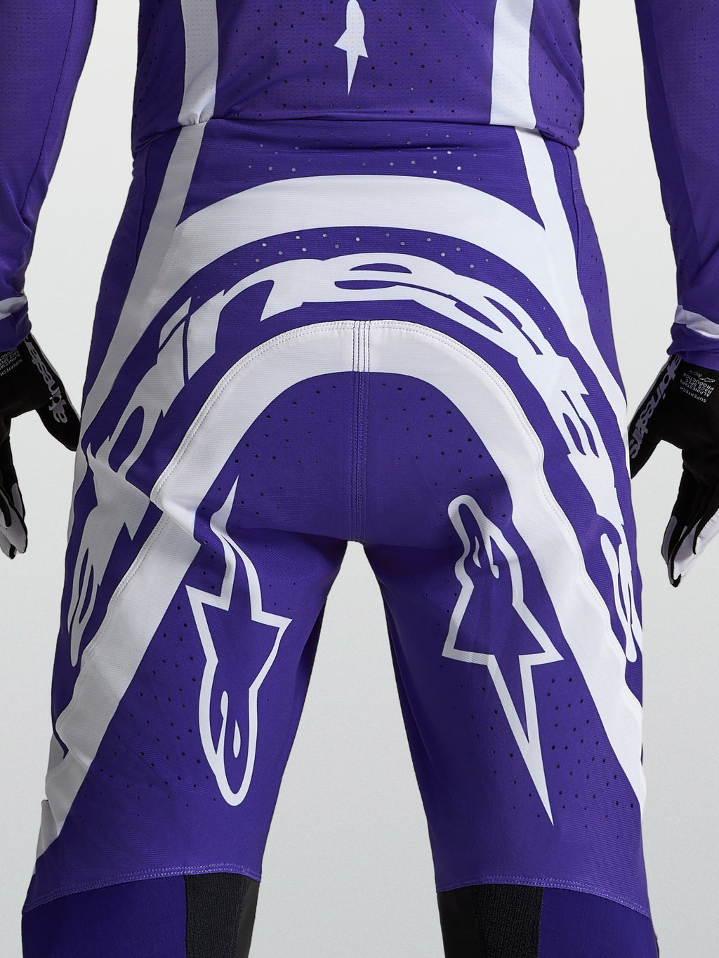 Alpinestars Supertech Vesta, calças de motocross para homem, azuis e brancas, vista traseira com logótipo e perfurações