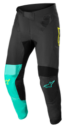 Alpinestars Supertech Blaze Pants, calças de motocross, preto, verde pastel e amarelo néon, com painéis de perna assimétricos, logótipos de estrela amarelos e turquesa, inserções de ventilação em malha e cinto de catraca ajustável para corridas todo-o-terreno