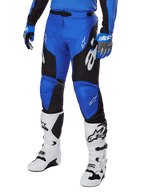 Alpinestars 2025 Racer Veil Pants, Motocross Pants, Blue and Black, with white graphic accents, worn with matching blue jersey, gloves, and white boots, durable protection gear for off-road racing