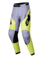 Alpinestars 2025 Racer Veil Pants, calças de motocross, cinzentas e amarelo néon, detalhes pretos na parte interna dos joelhos e na fivela da cintura, design ergonómico desportivo com logótipos Alpinestars, têxtil durável para corridas off-road