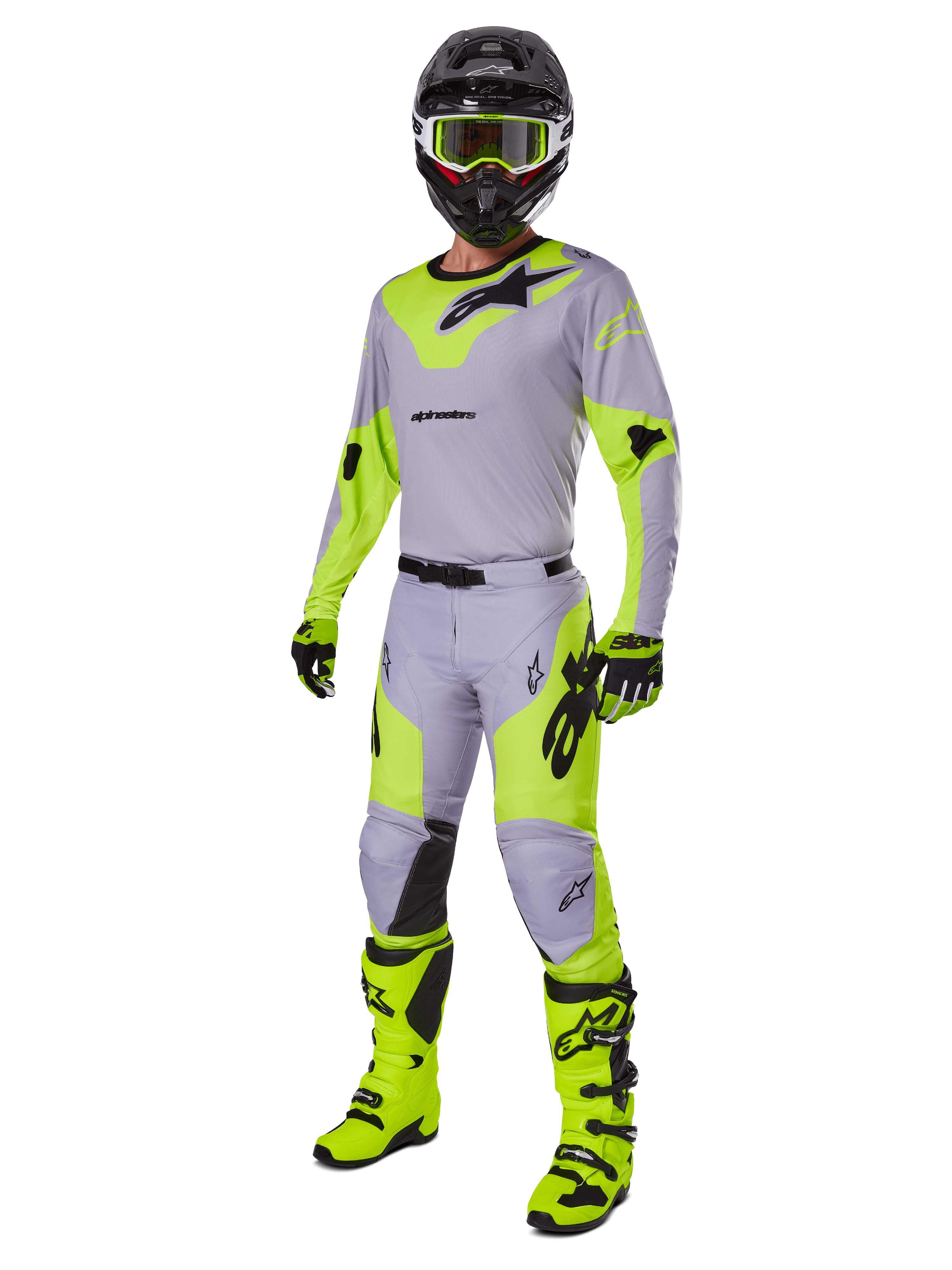 Calças Alpinestars 2025 Racer Veil, calças de motocross, cinzento e amarelo néon, usadas com camisola a condizer, capacete preto, óculos de proteção amarelo néon, botas e luvas, num conjunto de competição todo-o-terreno coordenado com design ergonómico e logótipos em destaque.