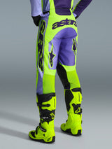 Alpinestars 2026 Racer Portl Pants, Motocross Pants, Purple and Yellow Fluo, back view featuring bold astars branding and purple accents, worn with matching fluo yellow motocross boots, durable synthetic material for off-road racing