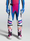 Calças Alpinestars Techstar Maven, calças de motocross off-road, brancas e azuis com detalhes coral vivo e painéis de pele nos joelhos.