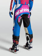 Alpinestars Techstar Maven, calças de motocross para homem, azuis e cor-de-rosa, vista traseira, com ganchos Babel e painéis elásticos, equipamento de corrida todo-o-terreno