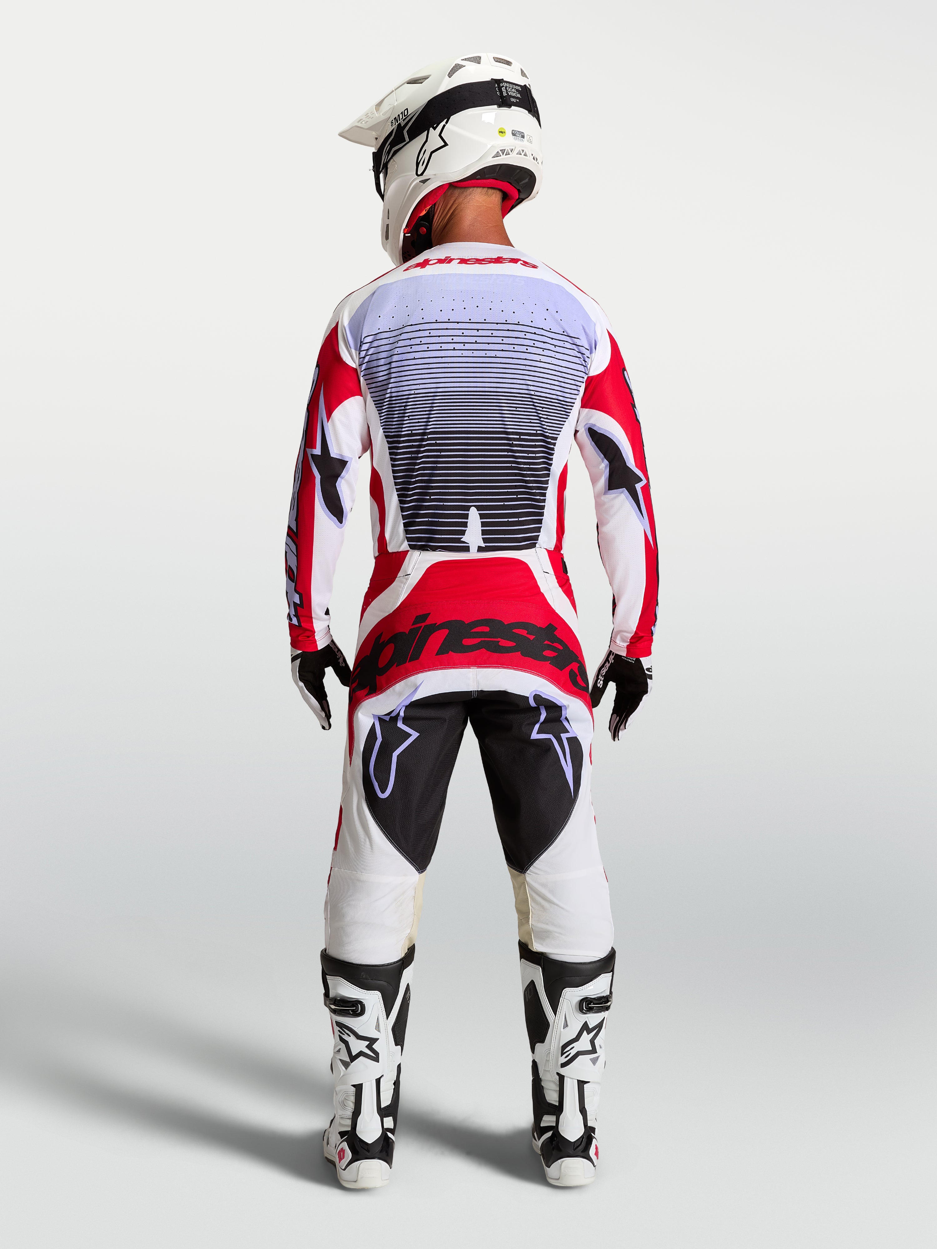 Alpinestars Calças Techstar Maven, calças de motocross vermelhas e brancas, vista traseira com ajuste race atlético