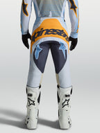 Alpinestars Techstar Maven, calças de motocross para homem, azuis e laranja, em poliéster 600D, vista traseira.