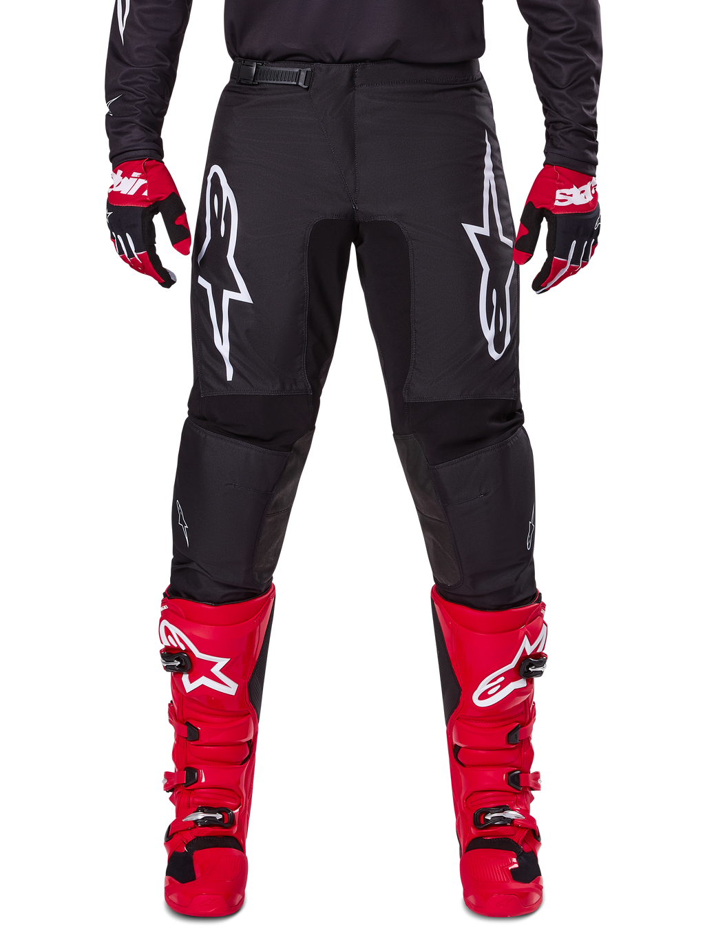 Alpinestars 2025 Fluid Haul Gear Set, Black Motocross Pants with white Astars logos on thighs, paired with vibrant red boots and red and black gloves, coordinated motocross outfit for off-road racing