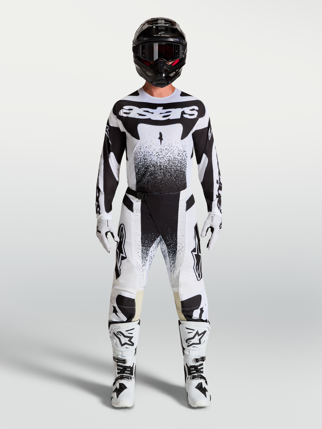 Alpinestars Techstar Swan, conjunto de motocross para homem, branco e preto, com camisola, calças e botas de moto.
