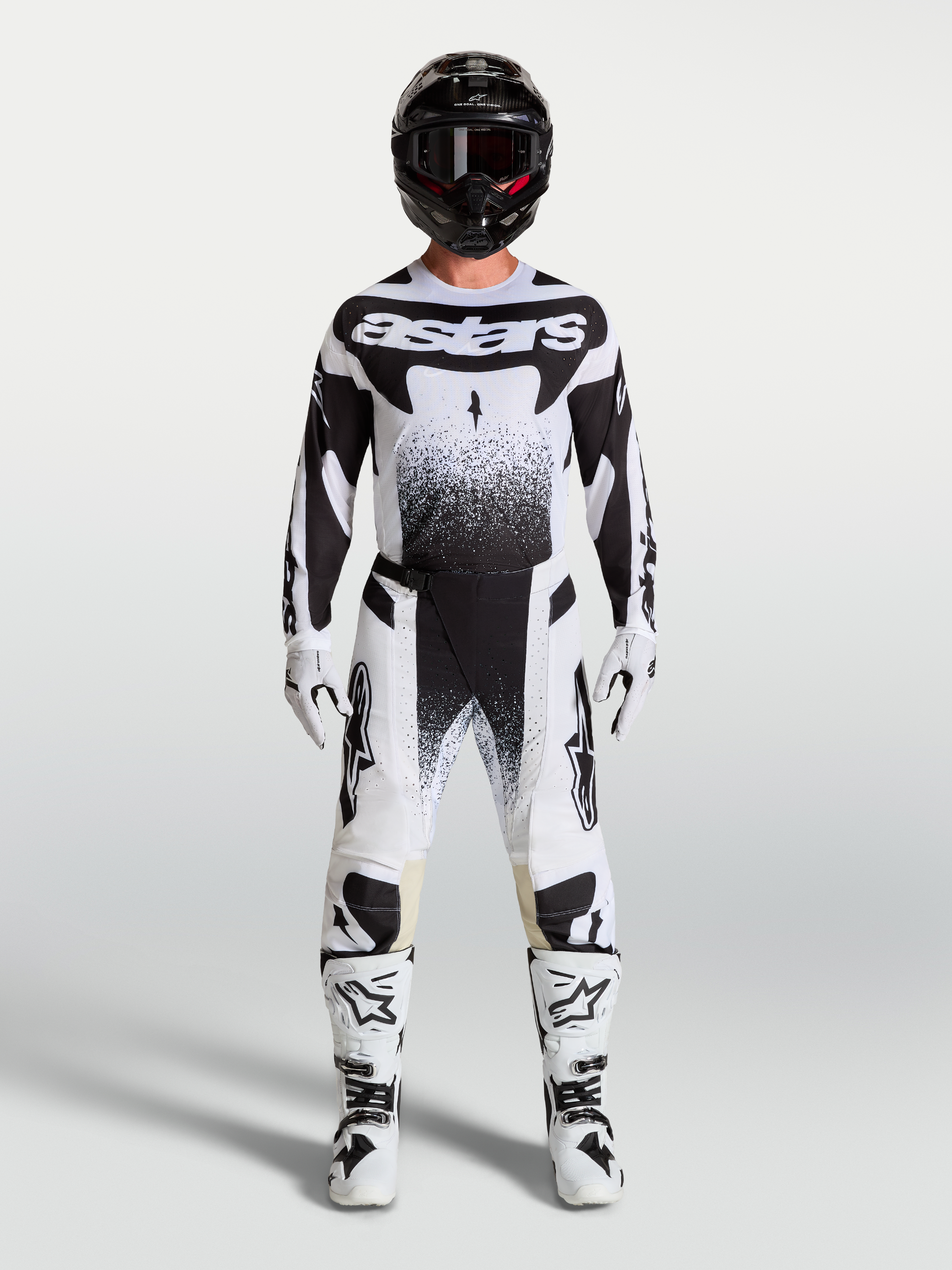 Alpinestars Techstar Swan, conjunto de motocross para homem, branco e preto, com camisola, calças e botas de moto.
