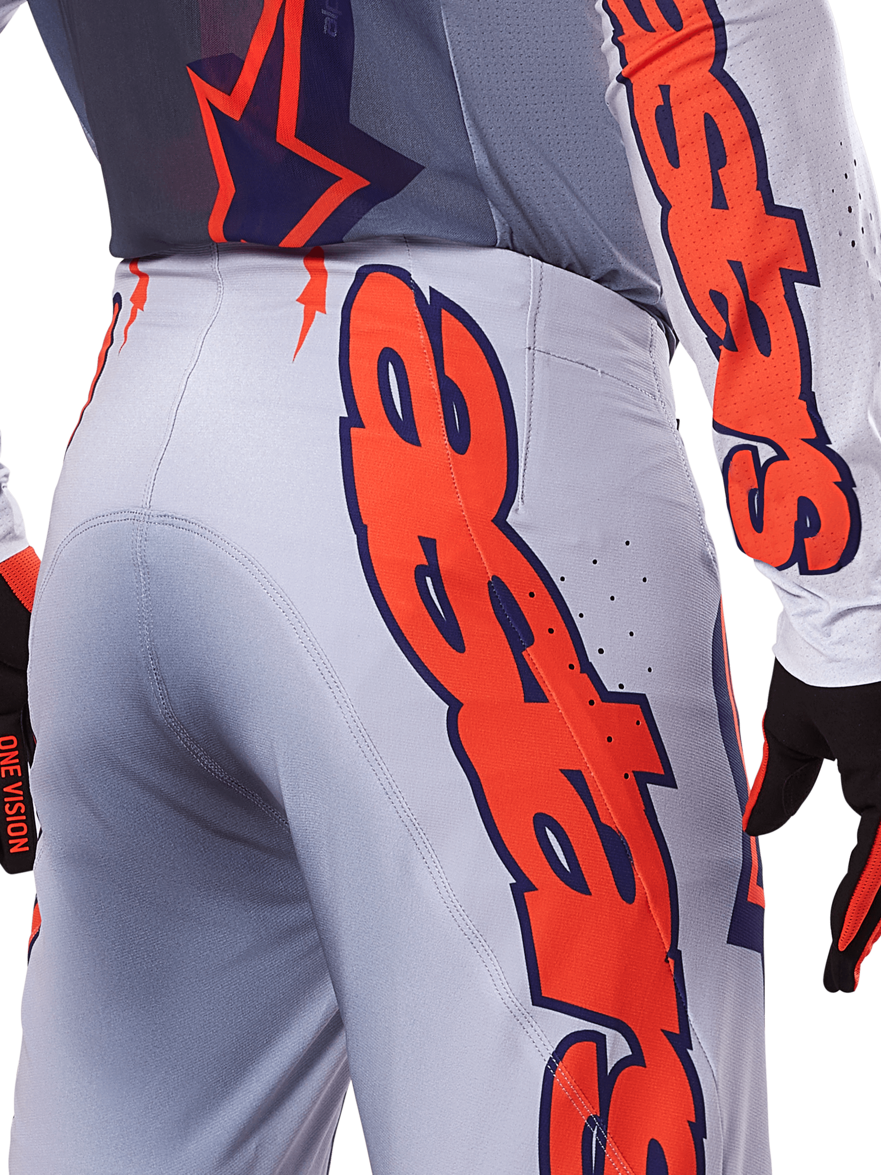 Alpinestars 2025 Supertech Lipan Pants and Jersey, Motocross Gear Set, Gray and Orange Fluo, close-up of the side and back showing large orange Alpinestars branding, performance rip-stop fabric with perforated ventilation