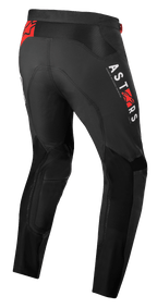 Alpinestars Supertech Foster Pants, calças de motocross, pretas, com marca vertical ASTARS branca e logótipos de estrela vermelha, construção têxtil de alta performance com painéis de malha para ventilação e liberdade de movimento.