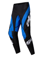 Alpinestars 2025 Techstar Dreem Pants, calças de motocross, pretas e azuis, com logótipos Alpinestars brancos, painéis azuis angulares sobre uma base preta, design atlético com áreas dos joelhos reforçadas para desempenho todo-o-terreno