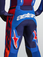 Calças Alpinestars Racer Hunt de motocross para homem, azuis e vermelhas com logótipo Astars branco e estrelas.