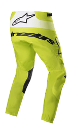 Alpinestars 2023 Techstar Push Pants, calças de motocross, amarelo néon e branco, vista traseira de três quartos com logótipos pretos e painel traseiro branco com logótipo de estrela, reforços pretos na parte interna das pernas, equipamento de corrida todo-o-terreno durável