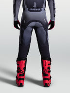 Calças Alpinestars Racer Amber, calças de motocross para homem, cinzentas, em polifibra 600D durável, vista traseira.