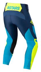 Calças Alpinestars Techstar Factory, calças de motocross, azul escuro, amarelo néon e azul brilhante, vista traseira com a marca 'ASTARS' no cós, painéis de malha perfurada para ventilação, remendos pretos no interior da perna e corte de corrida pré-curvado para desempenho em todo-o-terreno.