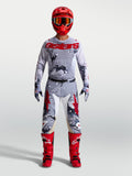 Alpinestars Racer Air Lone e Hunt Gear Set, fato de motocross camuflado cinzento e vermelho, camisola e calças ventiladas.