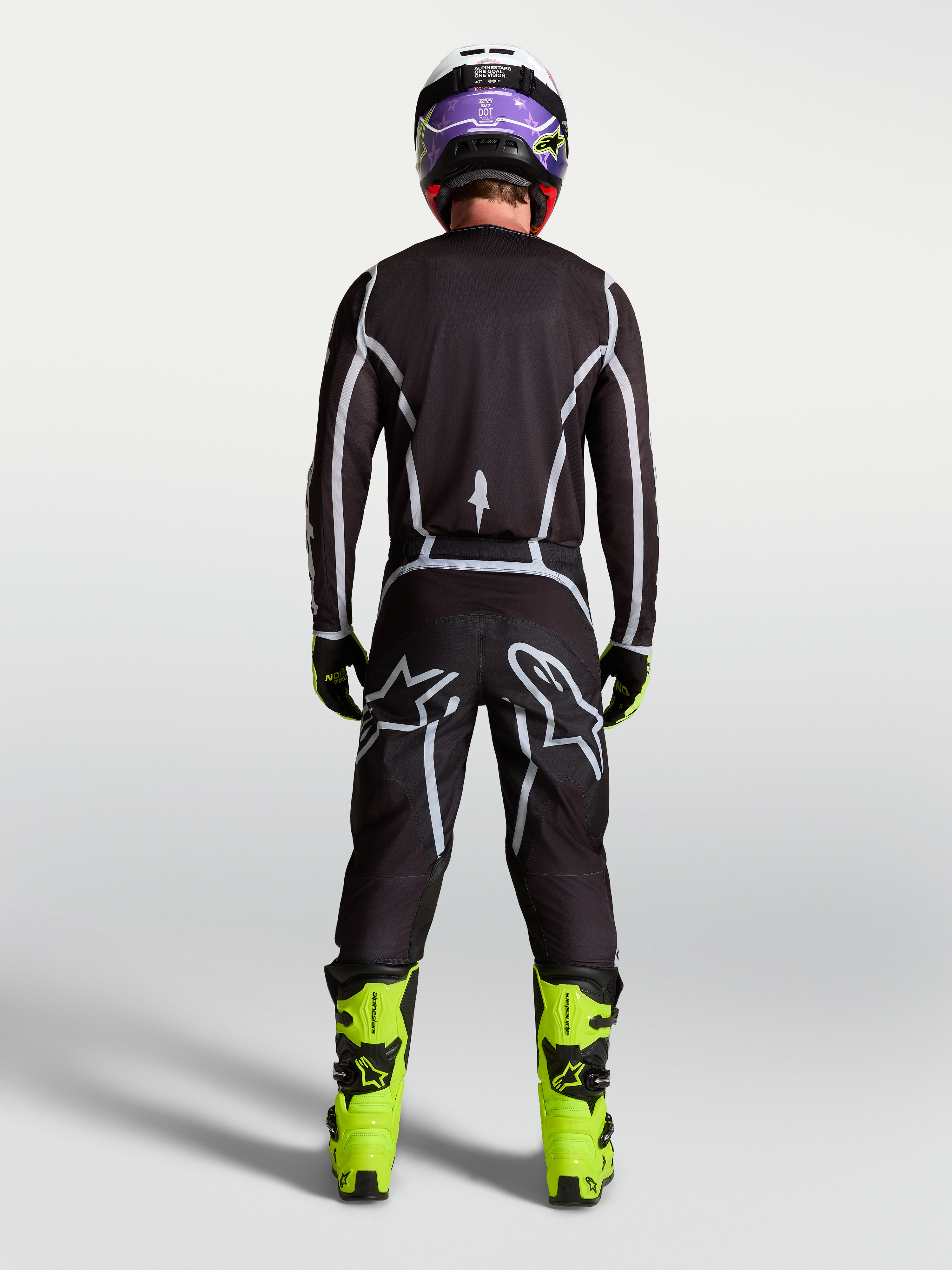 Alpinestars Calças Fluid Apex V2, calças de motocross para homem, pretas e prateadas, vista traseira com ajuste desportivo.