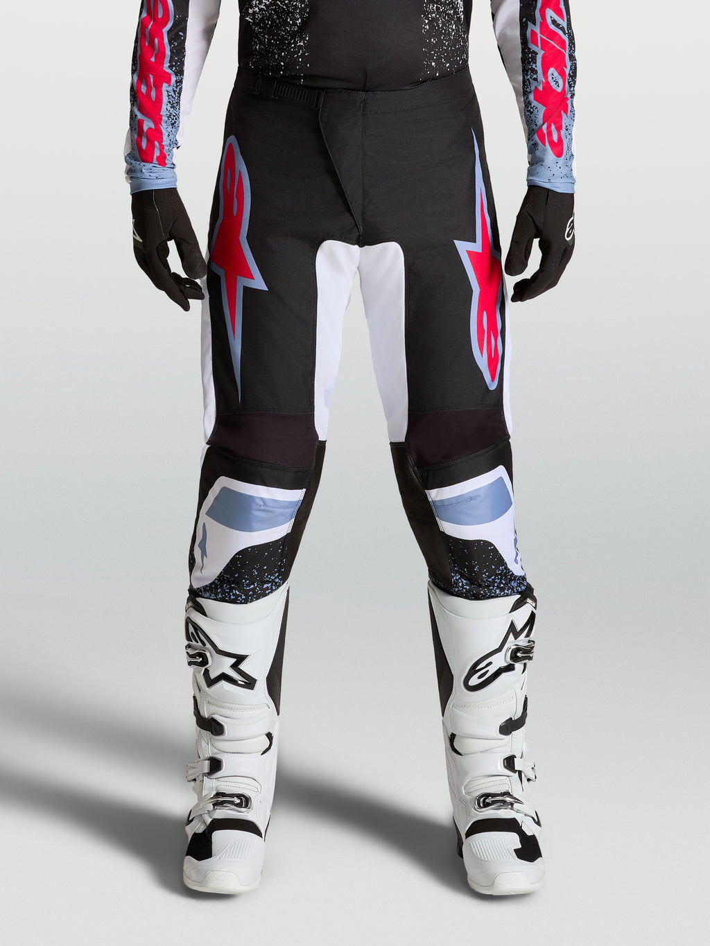 Alpinestars calças Fluid Drag, calças de motocross para homem, pretas e vermelhas, com politecido 600D e painéis elásticos.