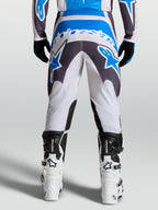 Alpinestars calças Fluid Drag, calças de motocross para homem cinzentas e azuis, com assento reforçado para todo-o-terreno.