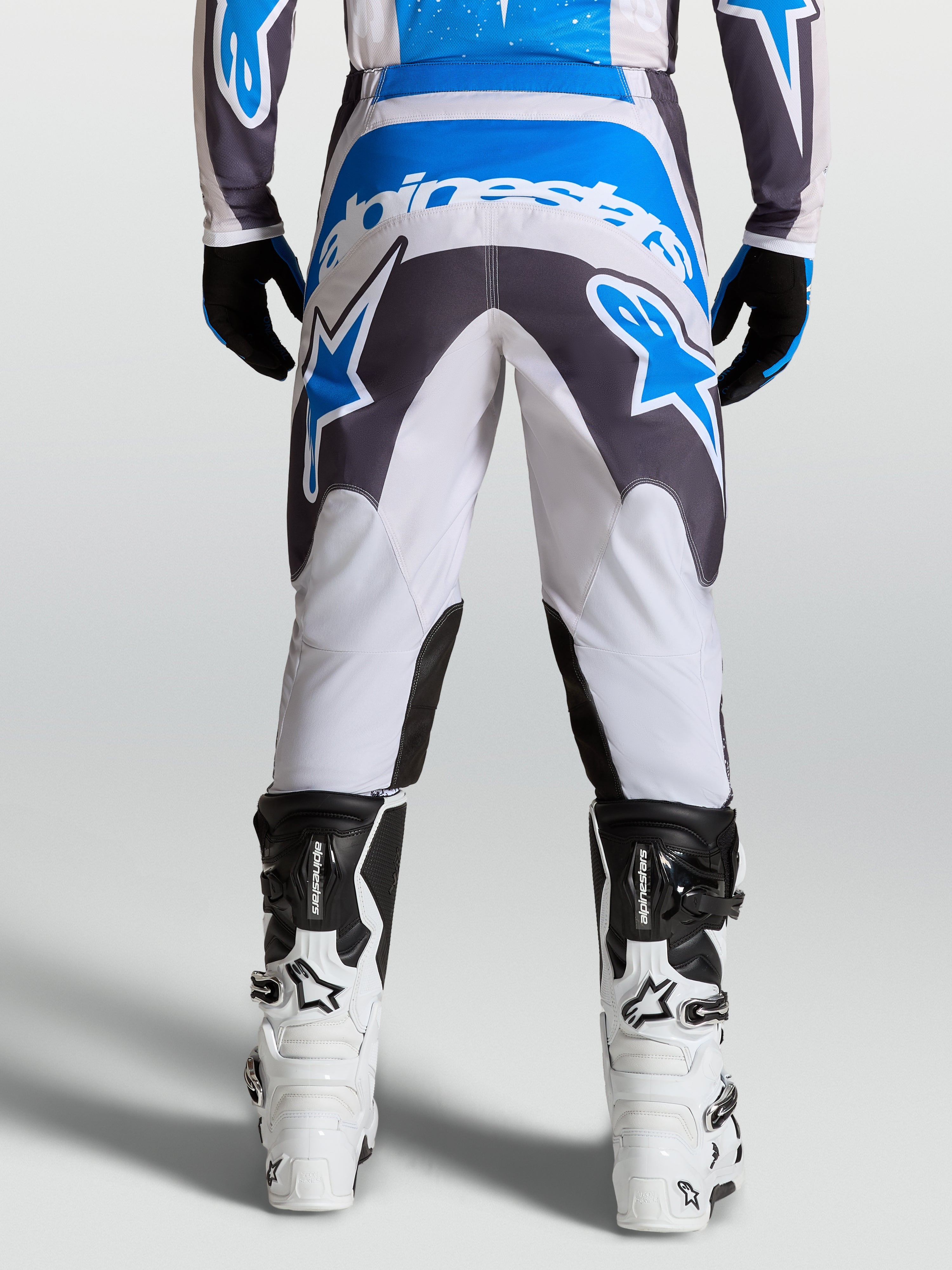 Alpinestars calças Fluid Drag, calças de motocross para homem cinzentas e azuis, com assento reforçado para todo-o-terreno.