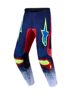 Alpinestars Fluid Drag, calças de motocross para todo-o-terreno, azul-marinho e vermelho com pormenores amarelo néon, construção em poli-tecido protetor.