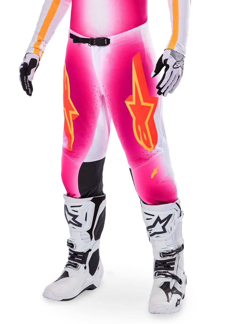 Alpinestars Supertech AFD MIG Limited Edition Motocross Pants, Pink with orange and yellow star logos, worn with white motocross boots and black and white gloves, featuring black inner knee panels and an athletic fit, part of a high-performance racing gear set
