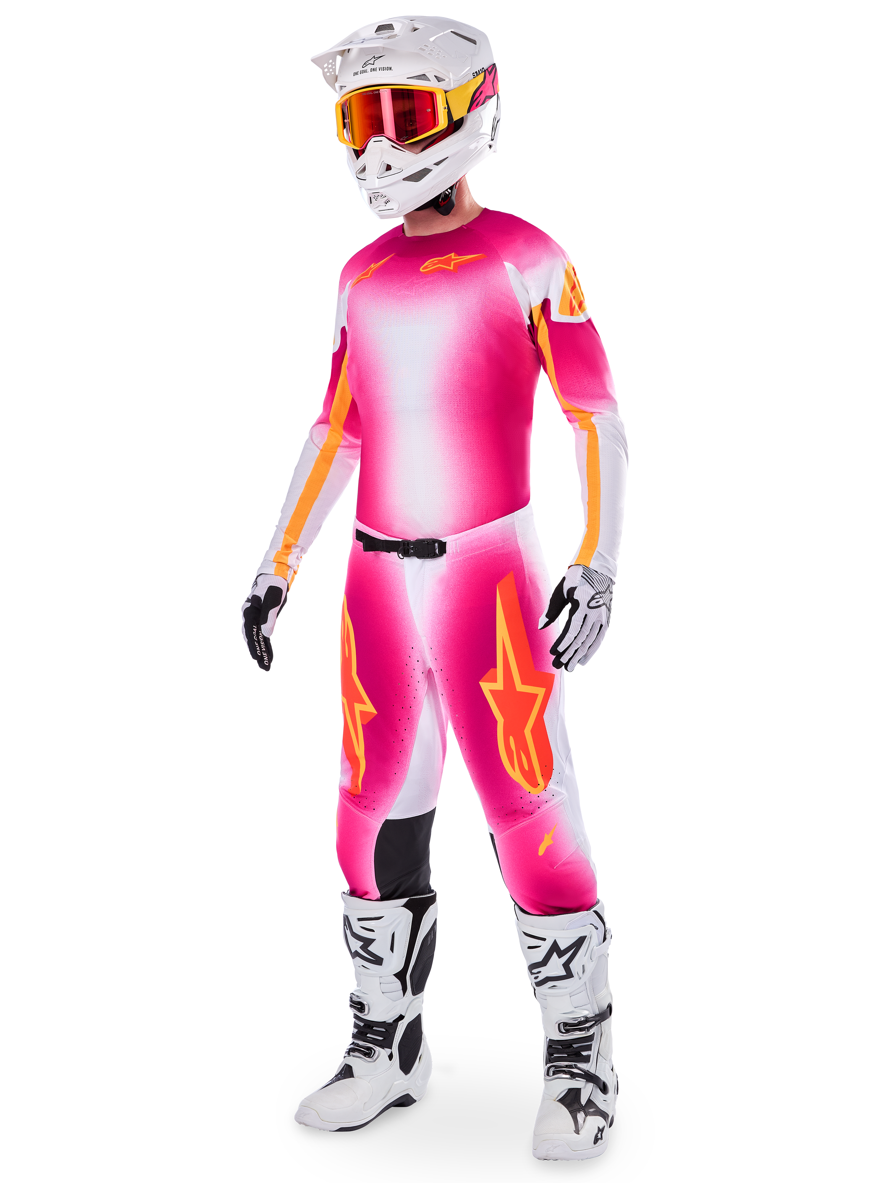 Motocross rider wearing the Alpinestars Supertech AFD MIG Limited Edition Gear Set, Pink Fluo White and orange gradient jersey and pants, white helmet with orange goggles, white and black boots, professional dirt riding apparel