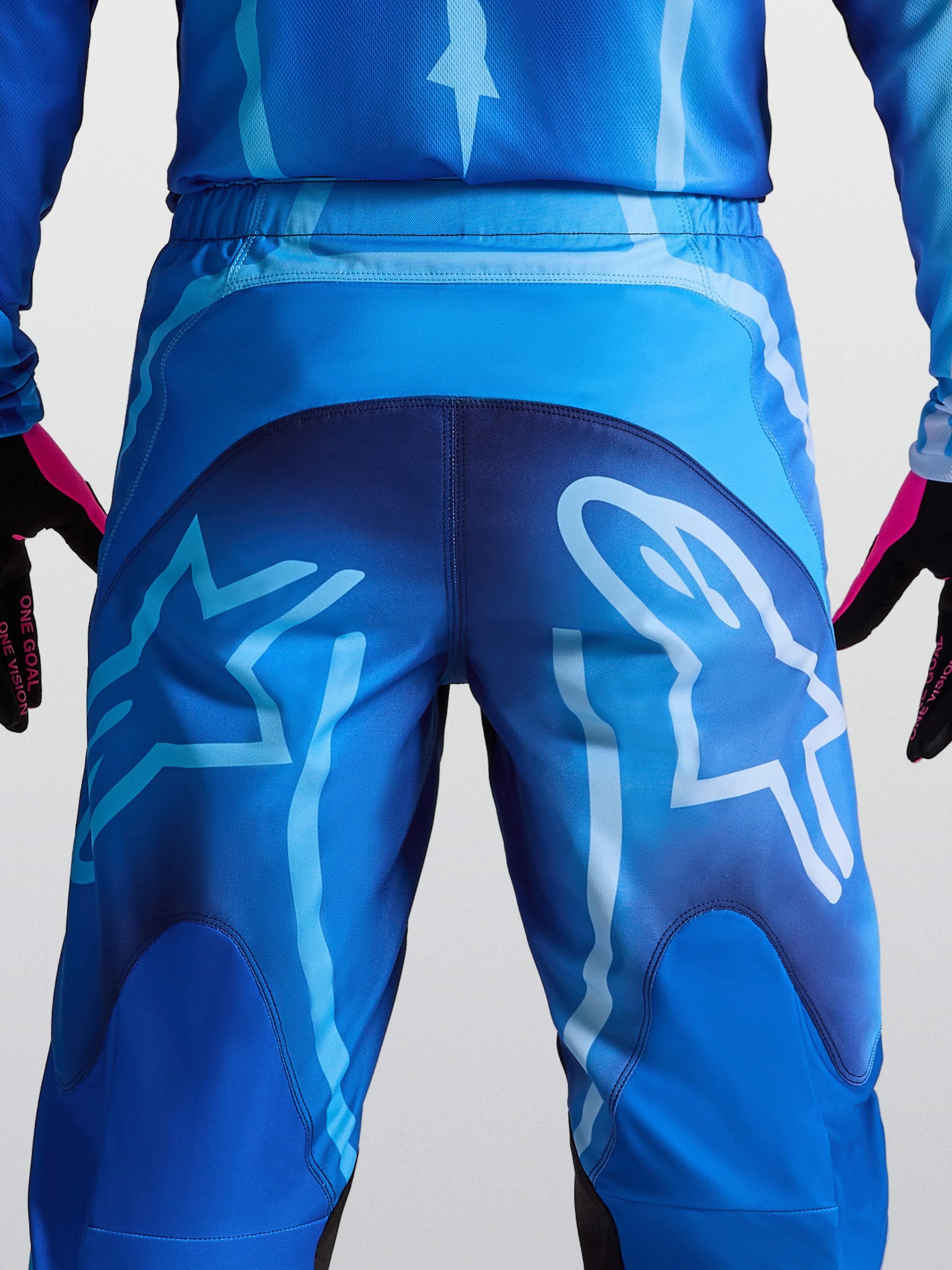 Alpinestars Calças Fluid Kepler, calças de motocross para homem, tons de azul, com logótipo Astars grande na parte traseira, construção resistente em polifabric 600D.
