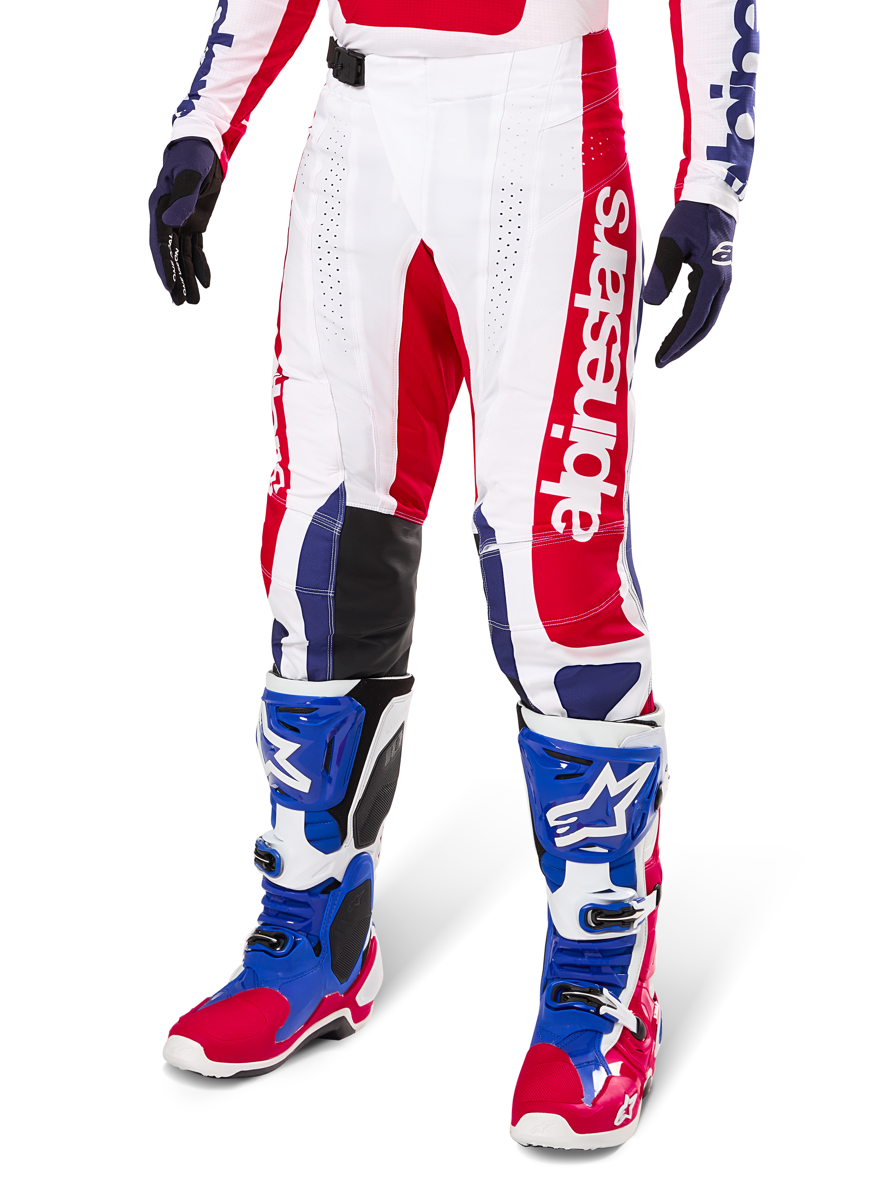 Alpinestars Limited Edition Techstar Fortitude Motocross Pants, Red White and Blue color scheme, worn with matching motocross boots and gloves, featuring vertical Alpinestars branding, athletic fit design for off-road racing