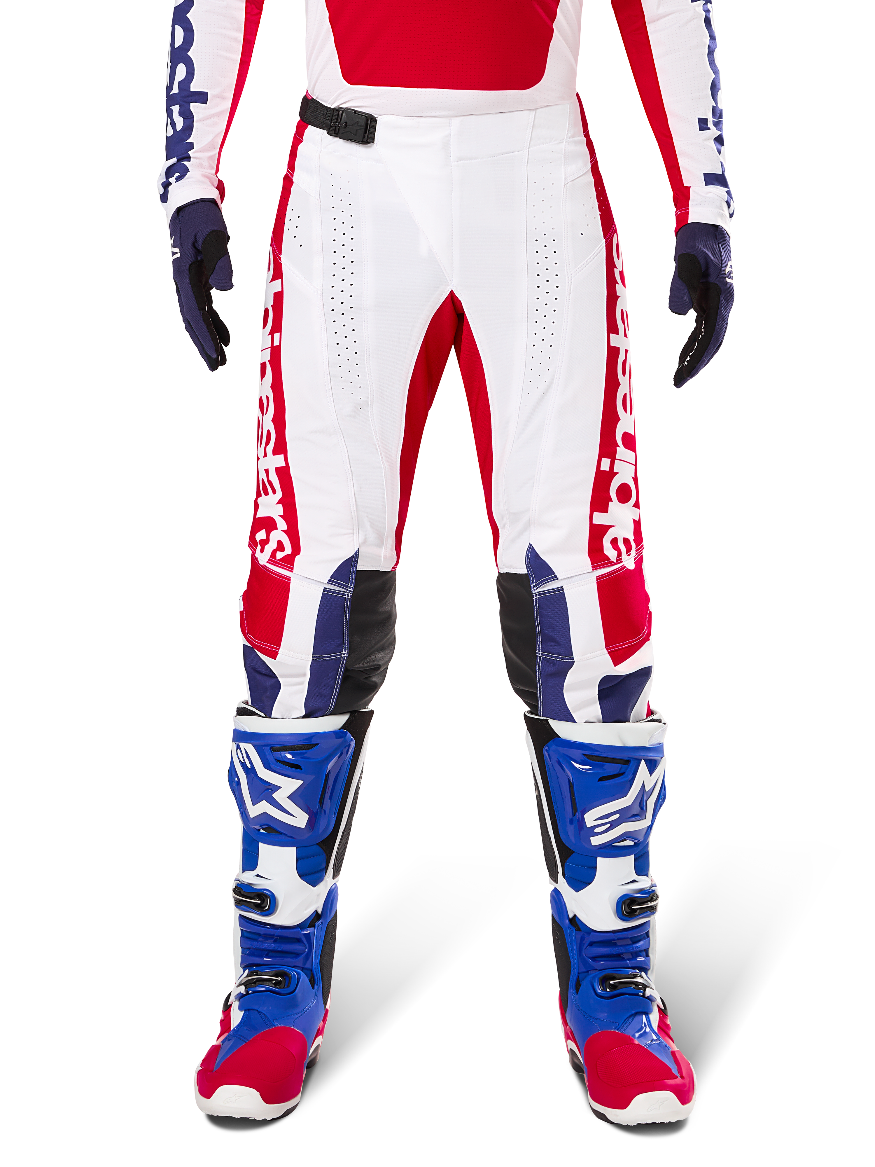 Limited Edition Techstar Fortitude Pants, Motocross Pants, Bright Red White and Blue, worn with matching gear including blue protective boots and gloves, featuring white chassis with red graphics, black leather knee panels, and laser-cut perforations, professional off-road racing apparel