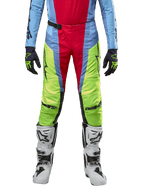 Alpinestars 2024 Techstar Ocuri Pants, Motocross Pants, Light Blue, Yellow Fluo, and Red Berry, worn with matching jersey and white motocross boots, featuring vibrant color-blocked panels and black logos, durable racing-fit design