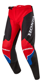 Alpinestars Honda Racer Iconic Pants, calças de motocross, vermelho vivo, preto e branco com detalhes azuis, com um logótipo HONDA grande em branco na coxa, marca Alpinestars nos joelhos, construção de perna ergonómica pré-curvada e fecho de cintura ajustável com catraca