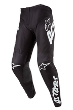 Alpinestars 2024 Racer Hana Pants, calças de motocross pretas com logótipos e detalhes em branco, design ergonómico pré-curvado, equipamento técnico para pilotagem off-road